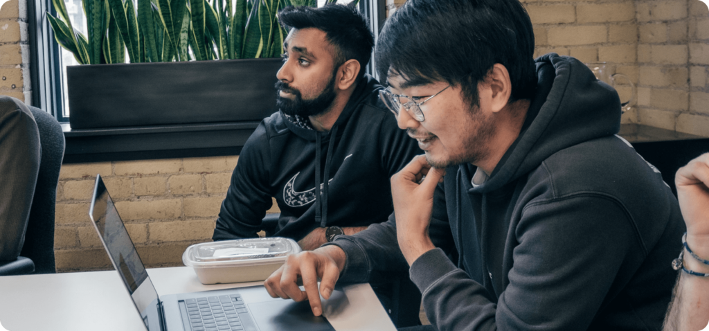 Team members are collaborating in a meeting.
