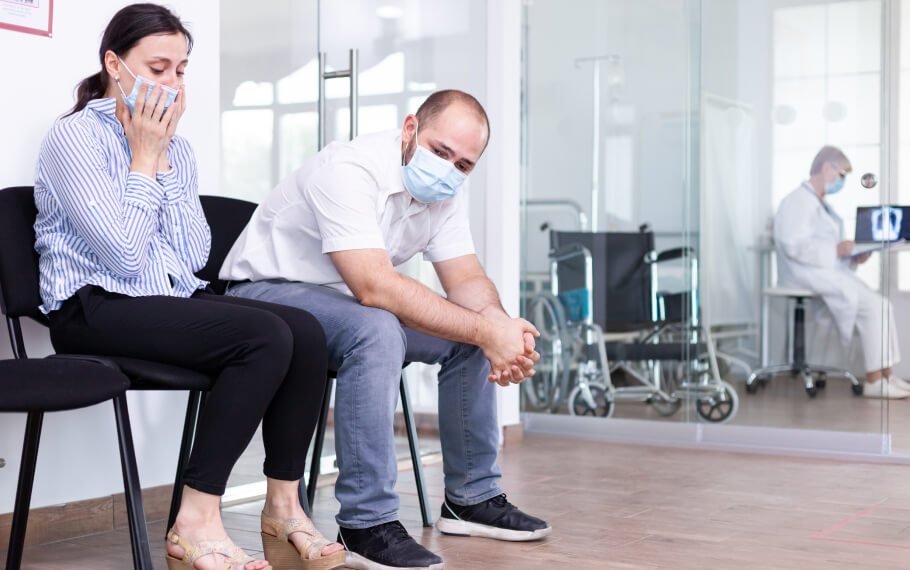 People are waiting in a waiting room for their appointment.